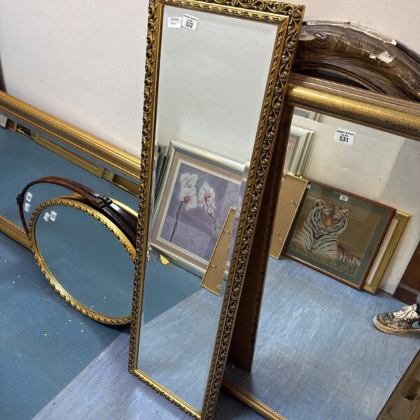 Elegant gilt framed bevel glass mirror for wall decoration.