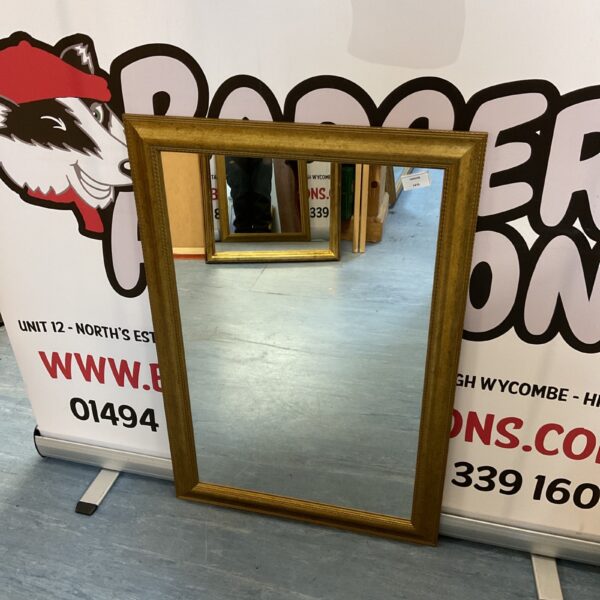 Vintage gilt framed rectangular mirror for wall decoration.
