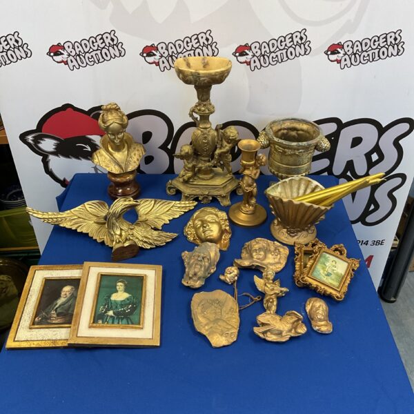 Gilt plaster cherubs, wooden eagle, and lady's bust sculpture collection.