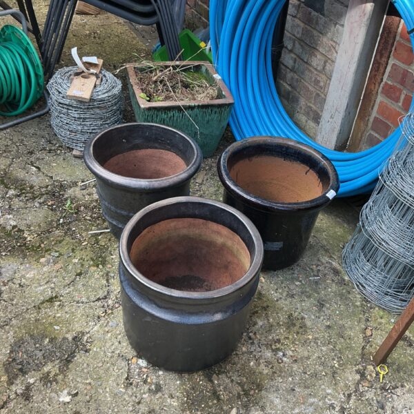 Lot of three glazed terracotta garden planters for outdoor use.