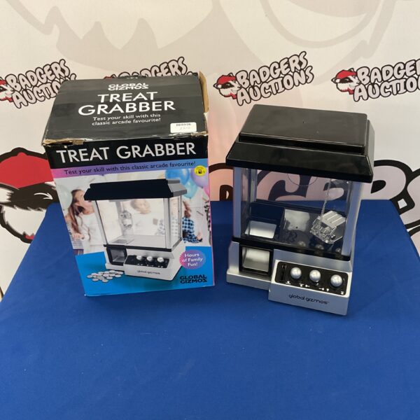 Front view of the Global Gizmos Treat Grabber arcade machine.