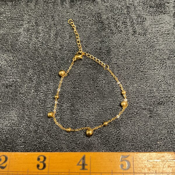 Elegant gold plated ball link bracelet for women.