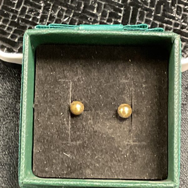 Gold plated stud earrings in a presentation box.