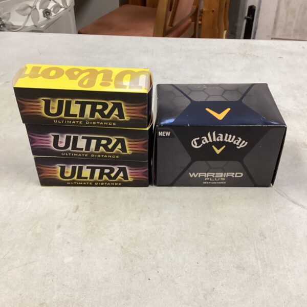 Unopened packs of Wilson and Callaway golf balls for sale.