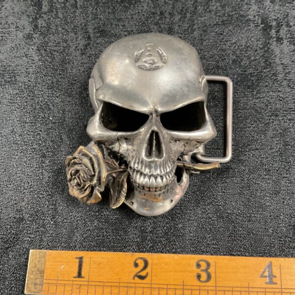 Detailed pewter gothic skull belt buckle with rose detail.