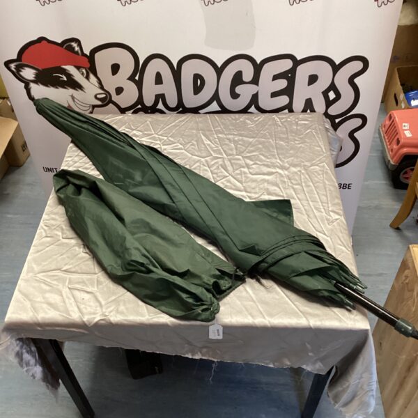 Green fishing umbrella for angling and outdoor shelter.