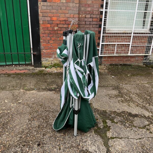 Green pop up gazebo with a steel frame, ready for outdoor use.