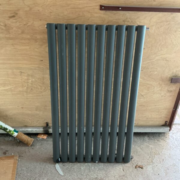Grey ladder radiator for central heating, modern home decor.