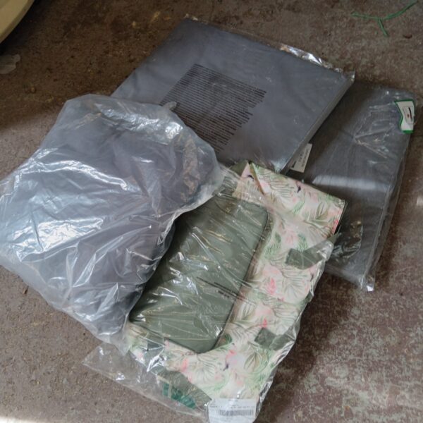 Grey outdoor cushions with a flamingo design, ideal for garden seating.