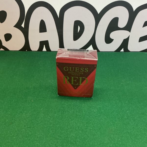 Vintage Guess Red aftershave bottle for men's grooming.