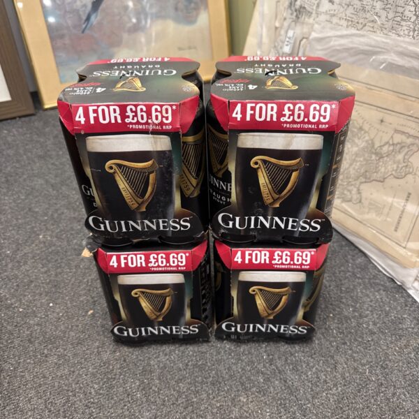 Four packs of Guinness cans with expiry date.