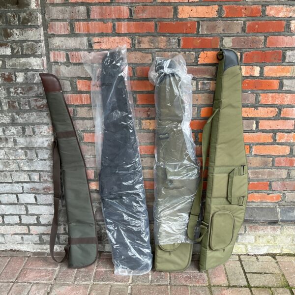 Lot of four new green gun slip cases for rifle protection.