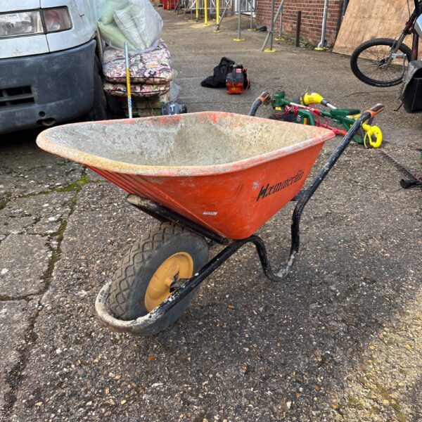 Used Hæmmerlin wheelbarrow in a garden setting.