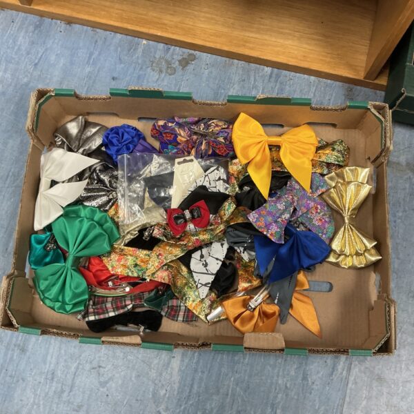 Colourful assortment of hair ribbon bows in a box.