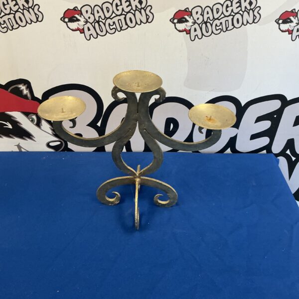 Vintage handcrafted metal candle holder with wrought iron design.