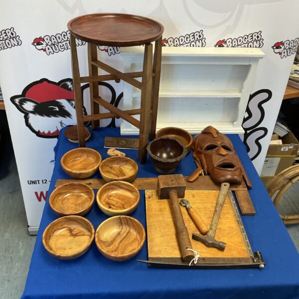 Collection of handmade wooden bowls and a small stool.