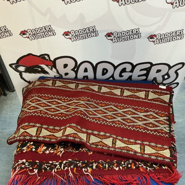 Vibrant handmade woven rug with geometric pattern.