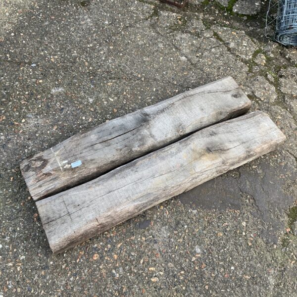Two hardwood timber planks with natural grain and texture.