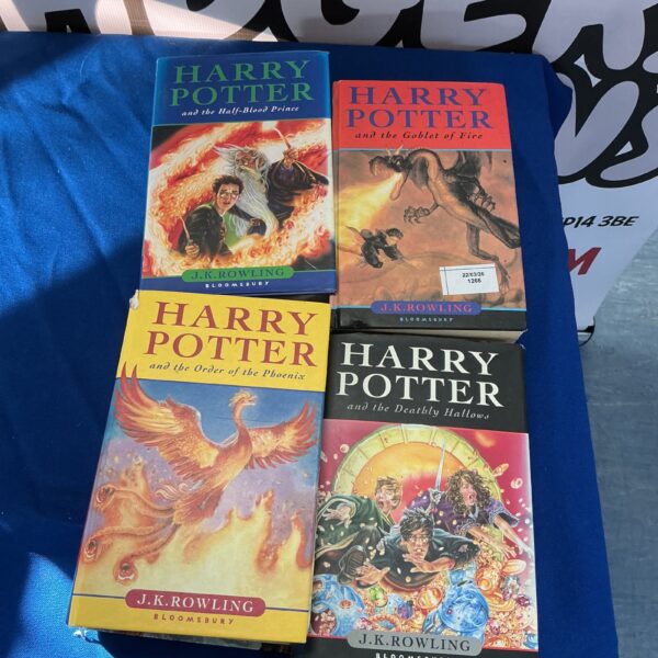 A lot of four Harry Potter books by J.K. Rowling.