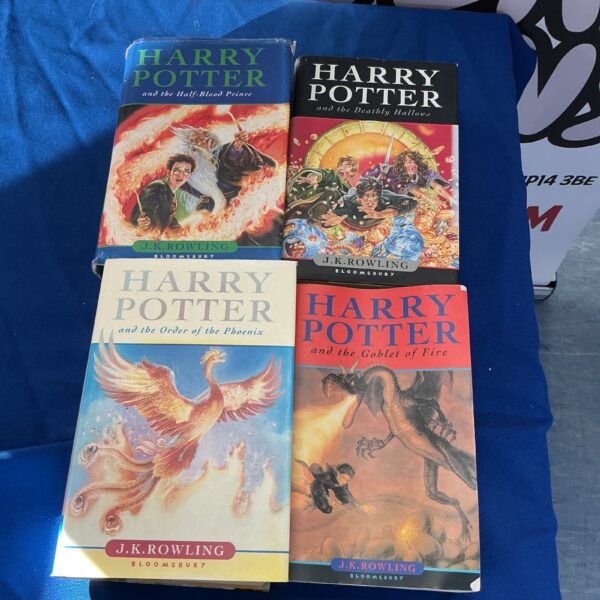 Four Harry Potter books by J.K. Rowling in a lot.