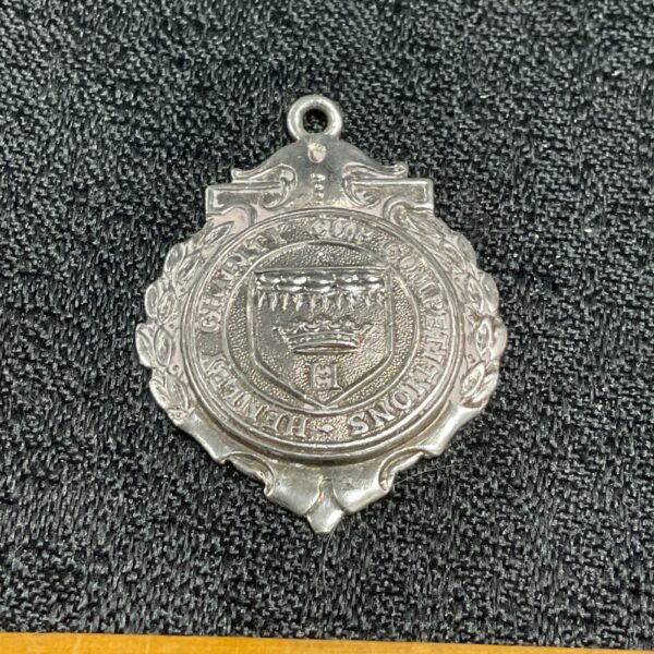 Silver Henley Charity Cup medal with ornate design.