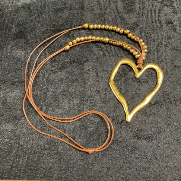Vintage hippy brass heart necklace with beaded strand.