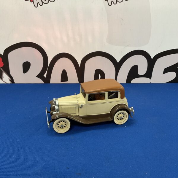 Vintage cream Hobley Toys diecast model car for collectors.