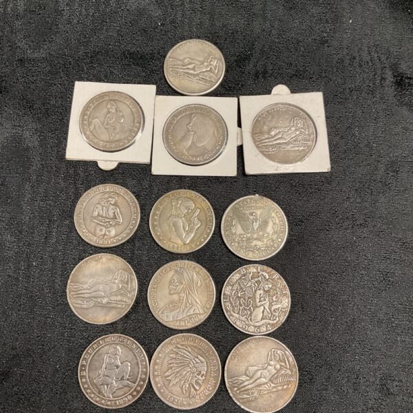 Overview of a diverse hobo nickel and altered coin collection.