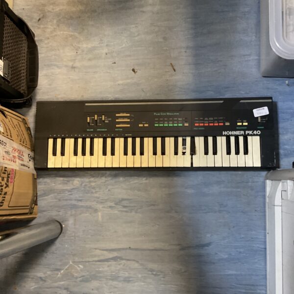 Vintage Hohner PK40 keyboard with keys and controls visible.