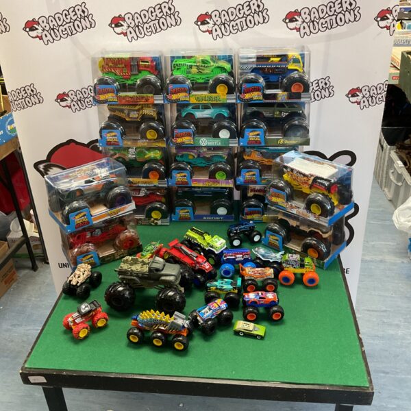 Large lot of Hot Wheels monster trucks, including oversized models.