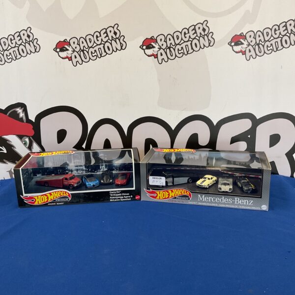 Two boxes of Hot Wheels Premium diecast cars, including Bugatti Chiron and McLaren.