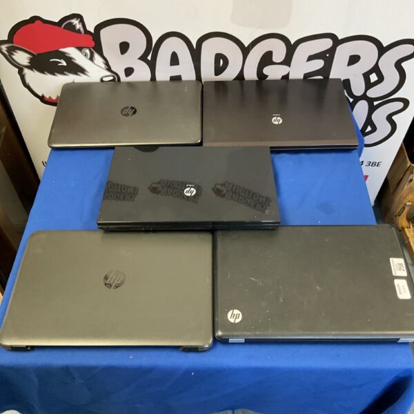 Bundle of used HP laptops for repair or parts.