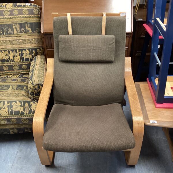 Beige Ikea Poang armchair with wooden frame.