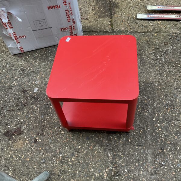 Red Ikea Tingby table on casters, modern side table.
