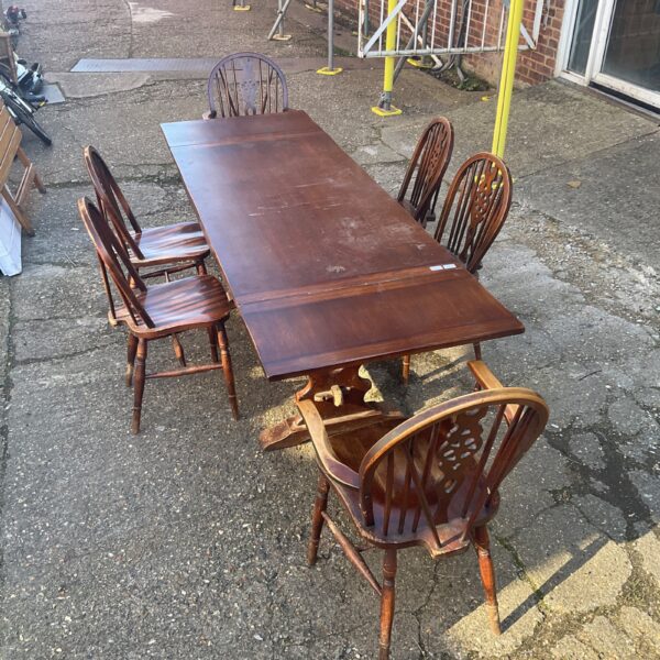 Oak dining table with six chairs