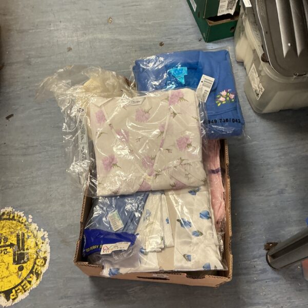 Box of new nightshirts and dressing gowns