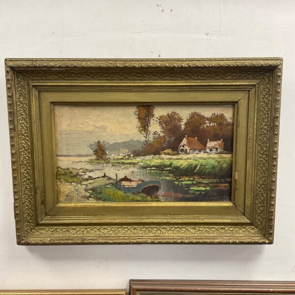 Signed impasto river landscape painting with cottages and gilt frame.