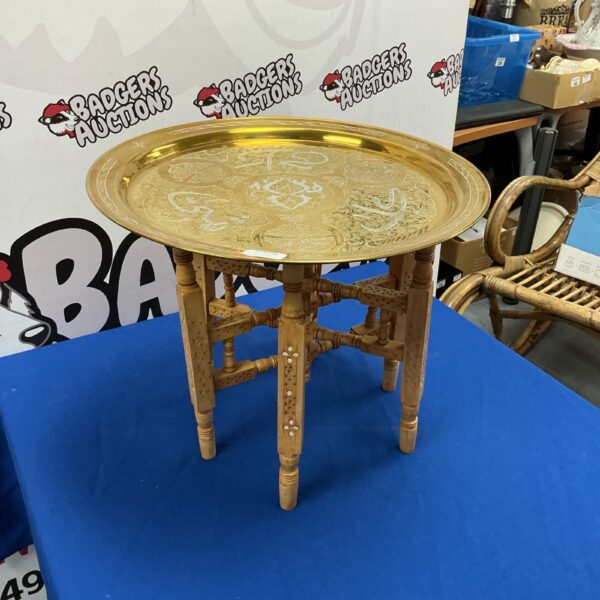 Intricate Indian copper folding table with embossed floral design.