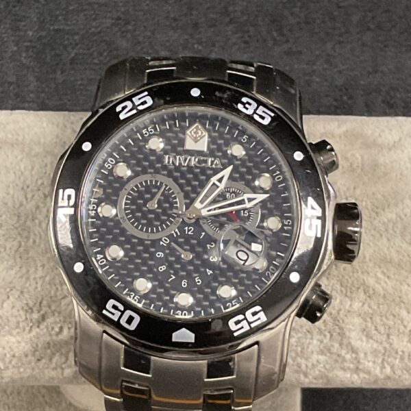 Front view of an Invicta quartz wristwatch with stainless steel band.