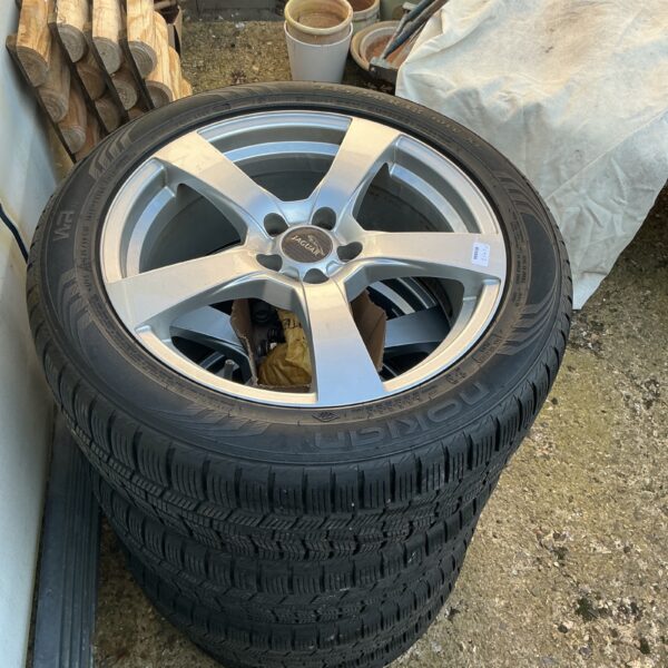 Set of four 19-inch Jaguar alloy wheels in used condition.