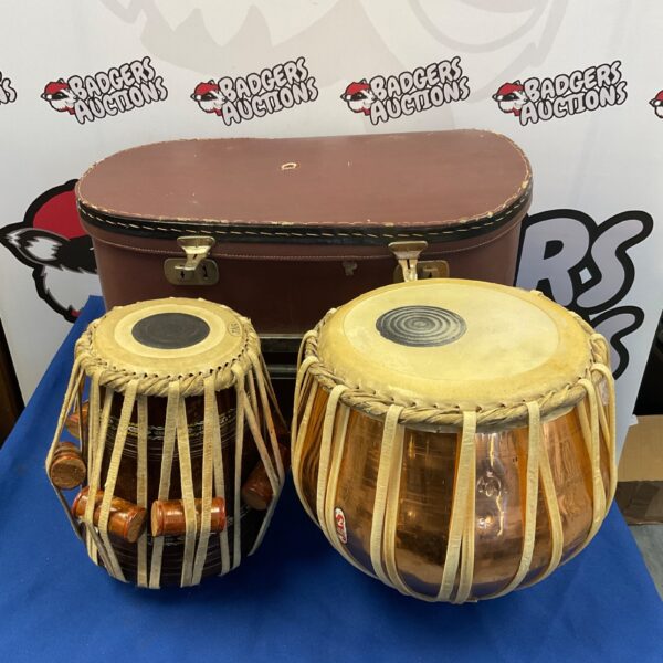 Vintage Jas bongo drums in a travel case, percussion instrument.