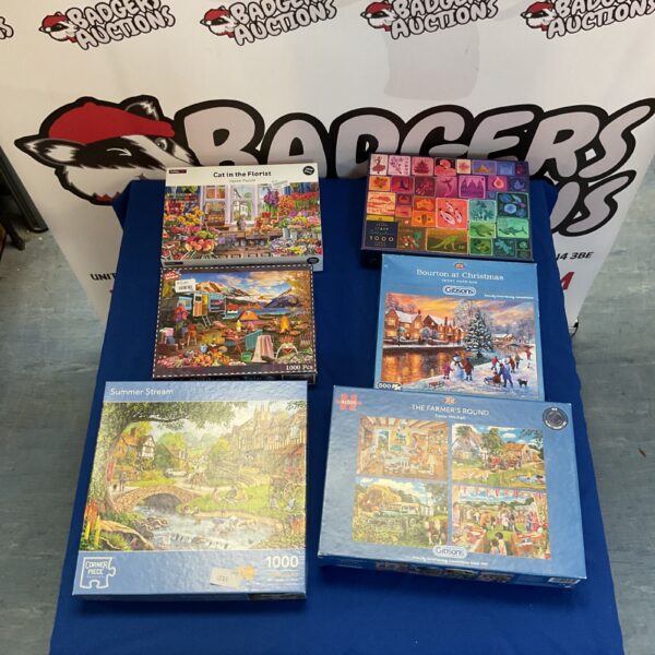 Overview of a lot of six jigsaw puzzles.
