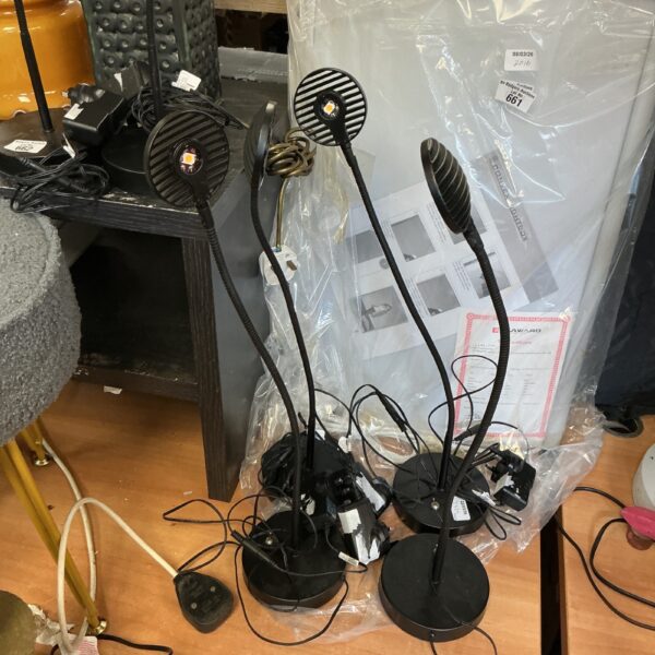 Four black John Lewis LED reading lamps for desk or task lighting.