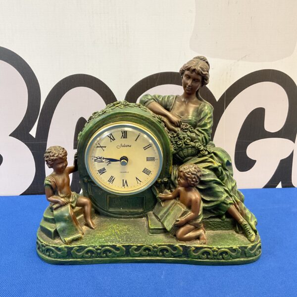 Vintage Juliana resin mantle clock with mother and children.