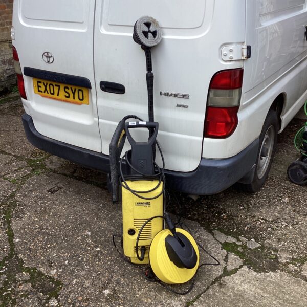 Used Karcher K4.99 pressure washer with brush attachment.