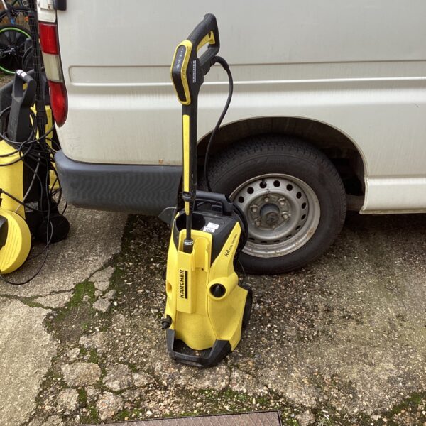 Used Karcher K4 Full Control pressure washer for garden cleaning.