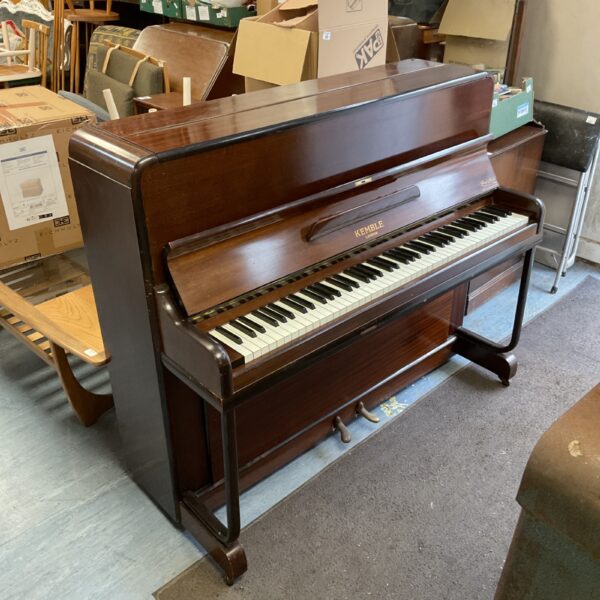 Vintage Kemble London upright piano in dark wood finish.