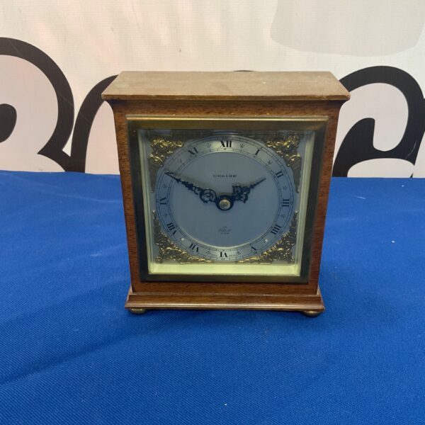 Antique Kendal and Dent mantle clock with brass case.