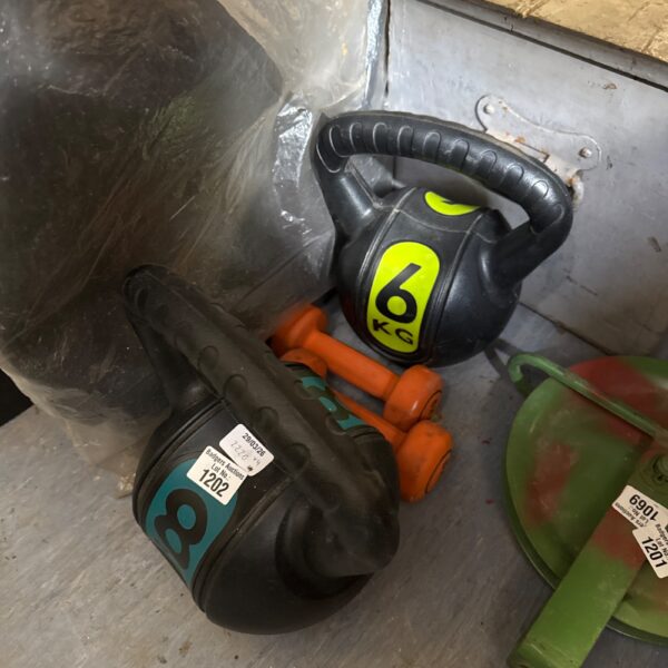 Fitness weights set including kettlebells and dumbbells for home workouts.