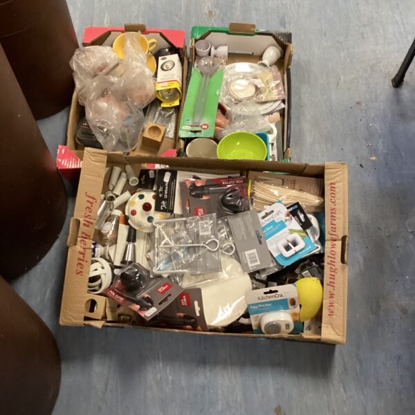 Assorted kitchenware lot with stainless steel and plastic items.